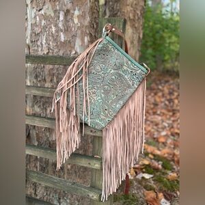 Small crossbody leather purse in a muted paisley embossed design brown/green